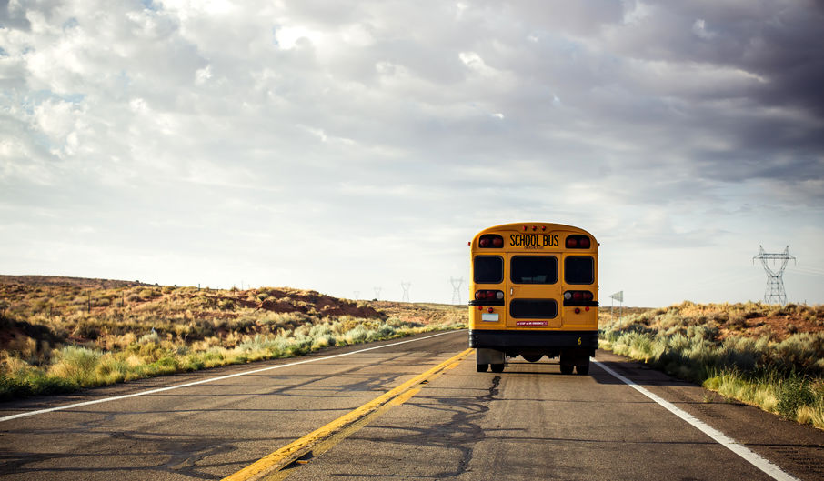 school bus riding on the road