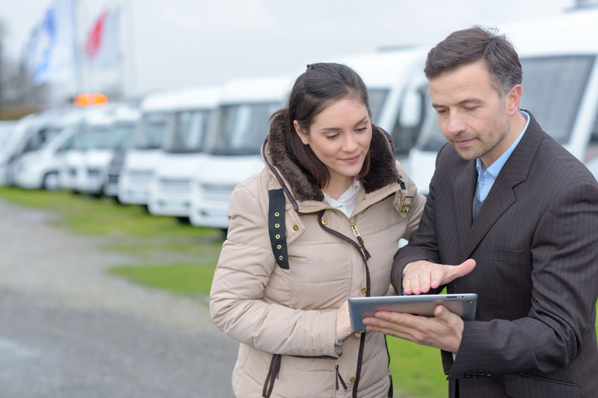 man selling bus to woman