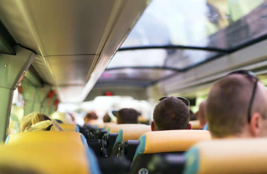 View from inside the bus with passengers.