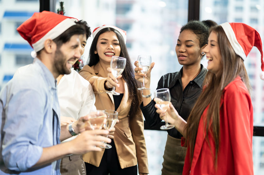 Group of various nationalities colleagues having Christmas and new year party in office